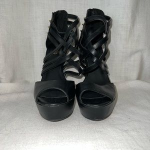 Black criss-crossed strapped high heels